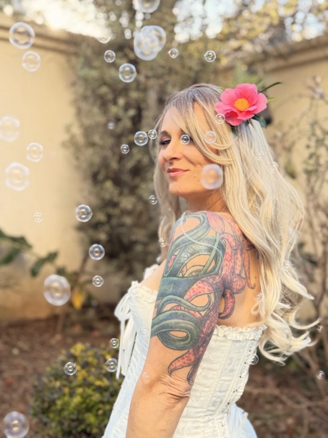 Bella surrounded by bubbles outdoors