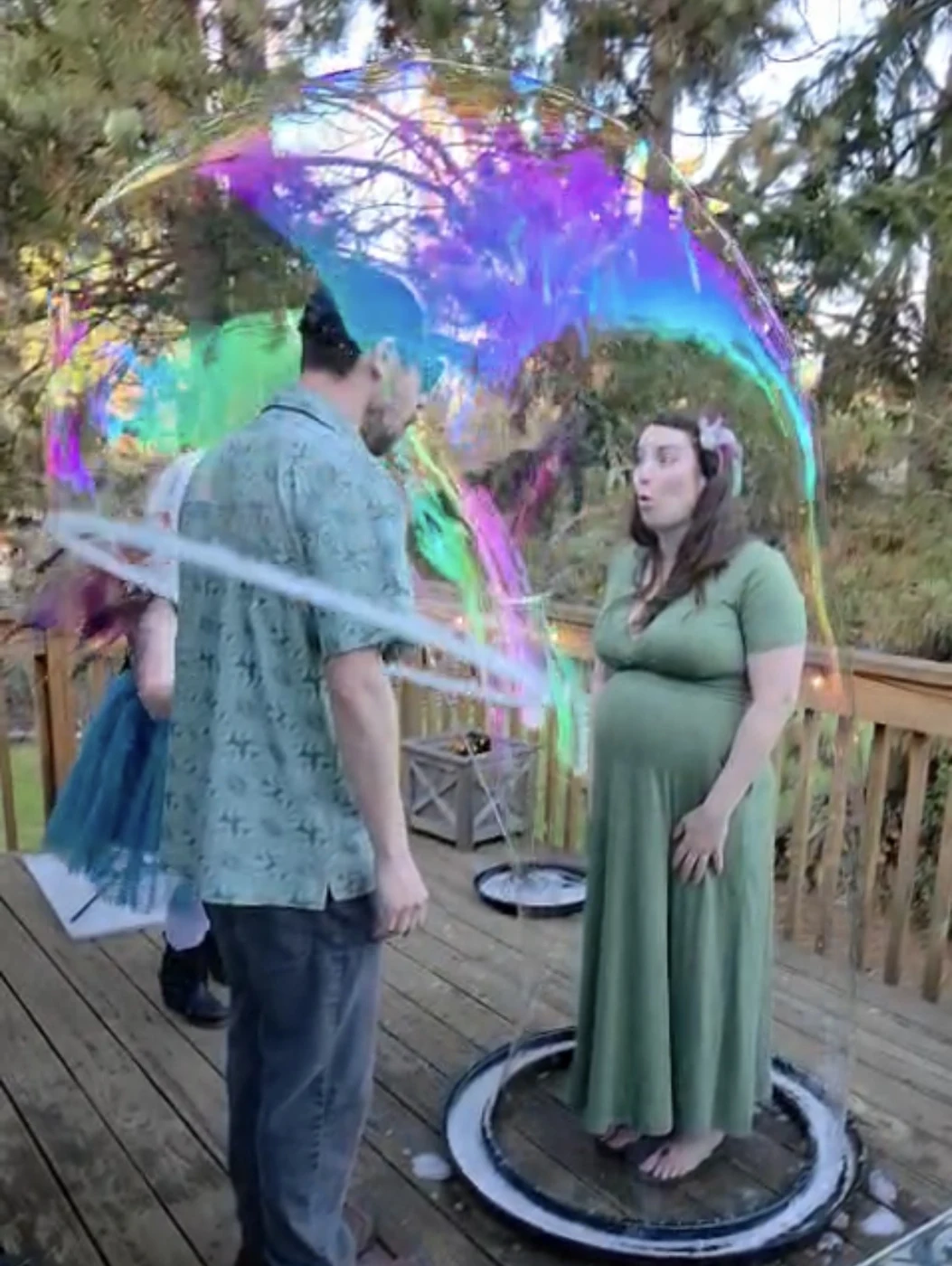 Guests standing inside a giant bubble at a celebration