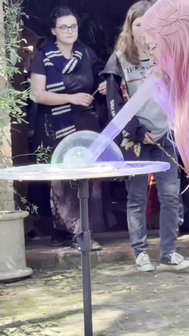 Bella showing a smoke-filled bubble at an outdoor party
